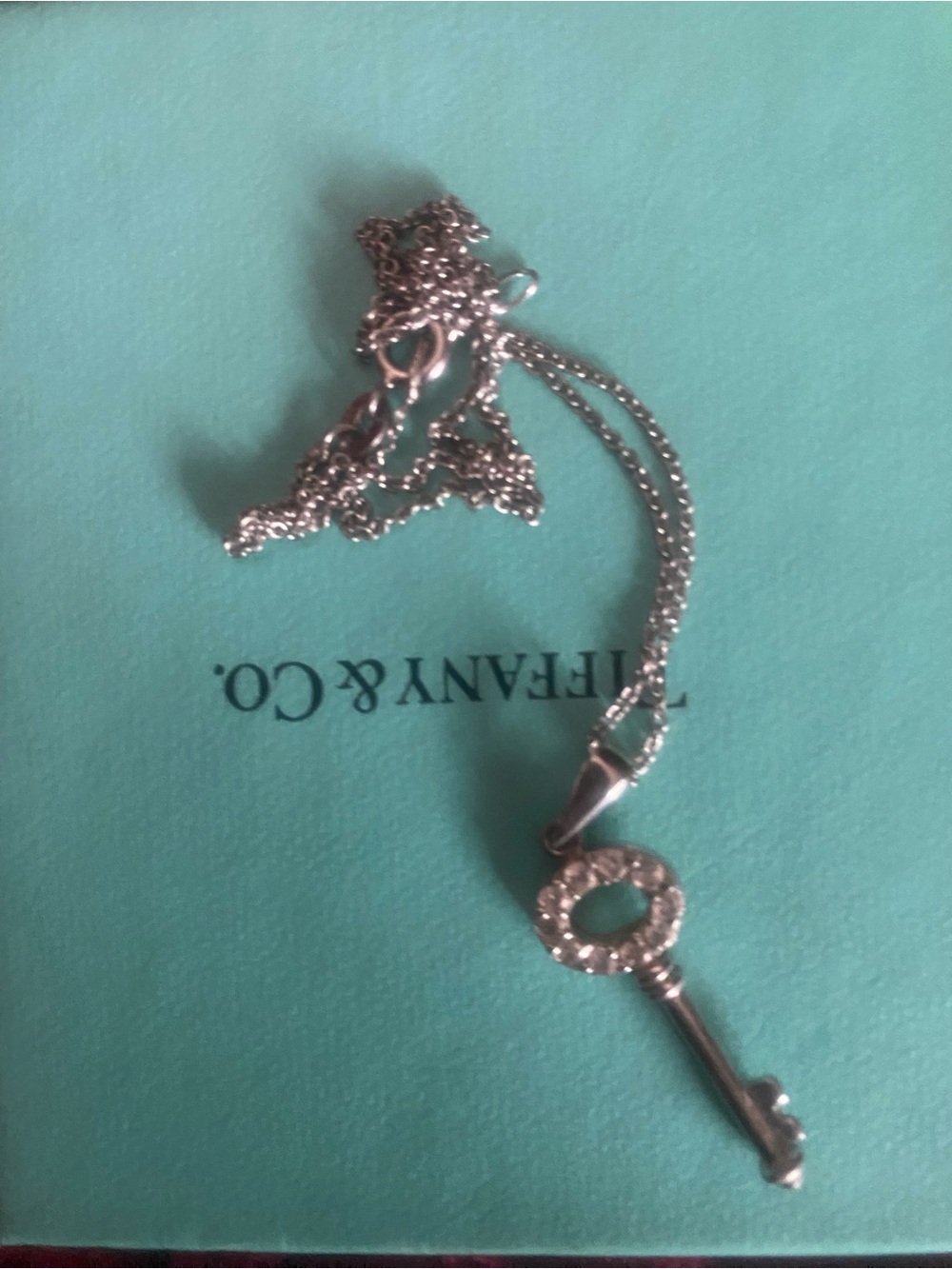 Tiffany & Co. Silver Key Pendant on Aqua Blue Card